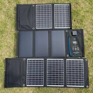 Rear view of the Sola-E 30W foldable solar charger, showing the zippered mesh storage pocket for holding cables and accessories