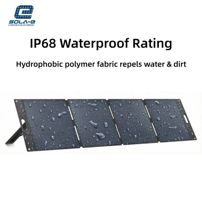 A four-panel foldable solar charger is shown unfolded and supported by its kickstand against a plain white background. The dark blue surface of the solar panels and the surrounding black frame are covered with numerous clear water droplets, demonstrating its water-resistant properties. Handles and metal grommets are visible on the edges of the panels.