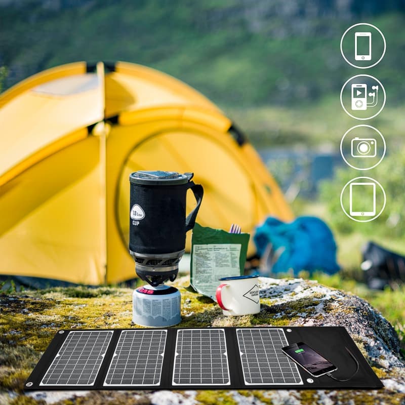 Portable solar panel charger connected to iPhone via USB for outdoor and emergency charging